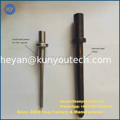 As peças da máquina de enchimento da cápsula brandamente encerram o rolo do dado e o rolo do dado do Paintball